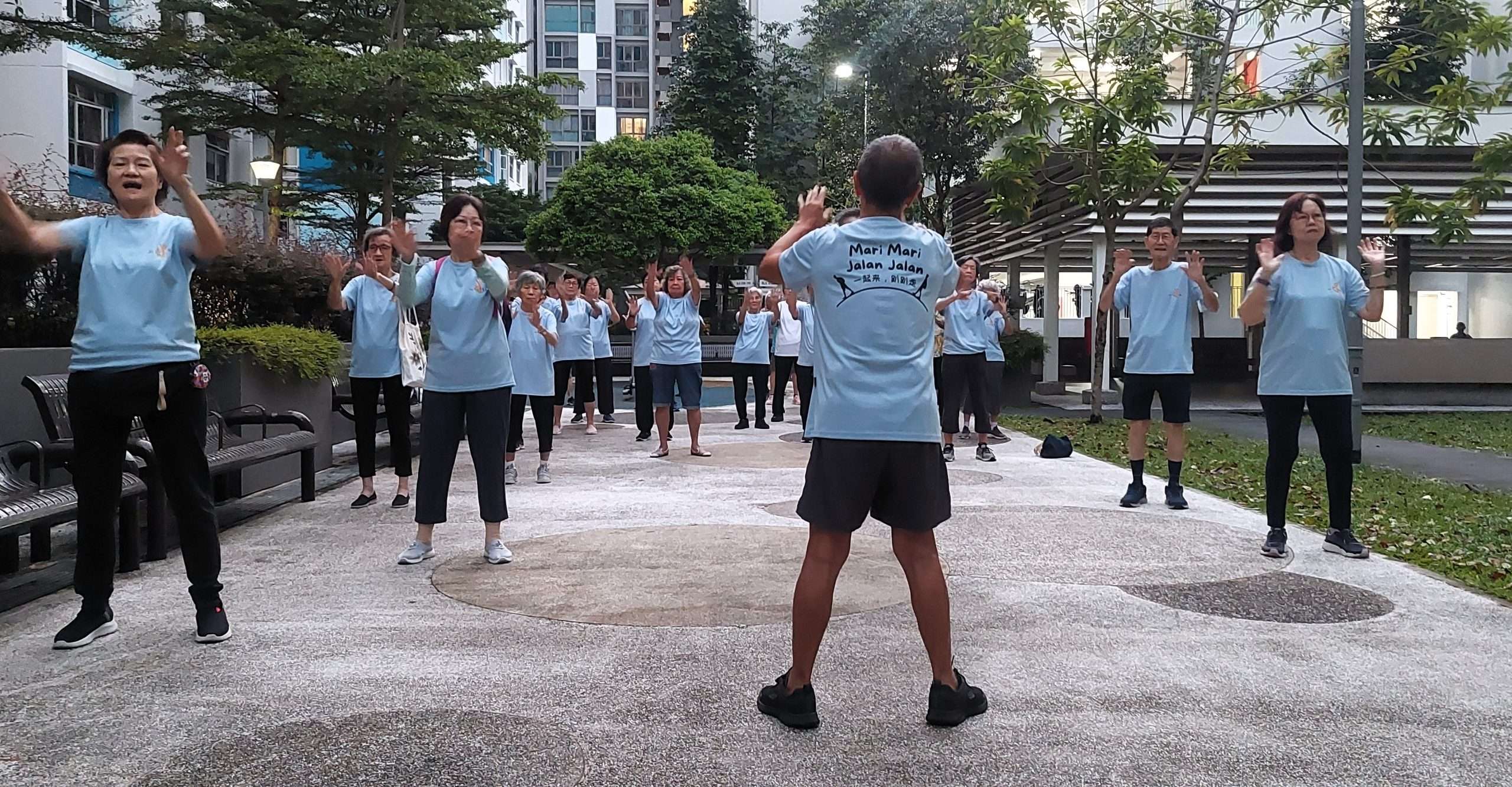 Mr Koh leads the Jalan Jalan group through warm-up